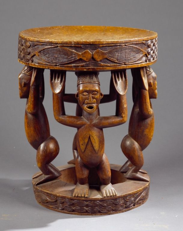 Tanzanian artisan hand-carving ebony wood